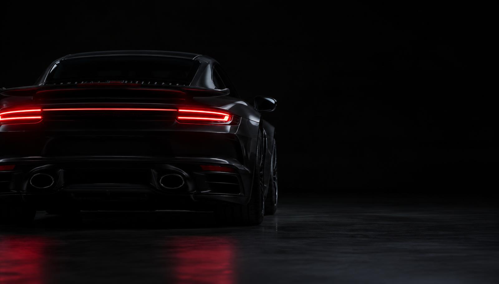 Sportinio automobilio galiniai žibintai tamsoje